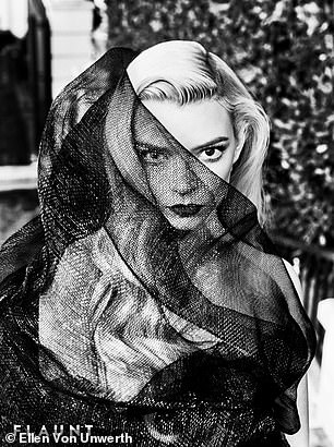 In a series of black and white shots, Anya's face was covered by a black veil.