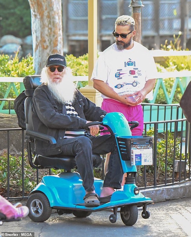 Shia appeared to have someone help push Isabel in a stroller while near her father Jeffrey, who switched from a manual wheelchair to an electric scooter.