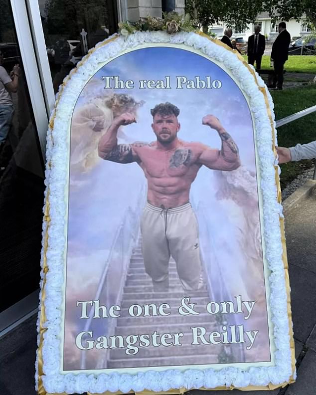 Photos from the funeral show printed images of a tattooed O'Reilly topless and flexing with the words: 