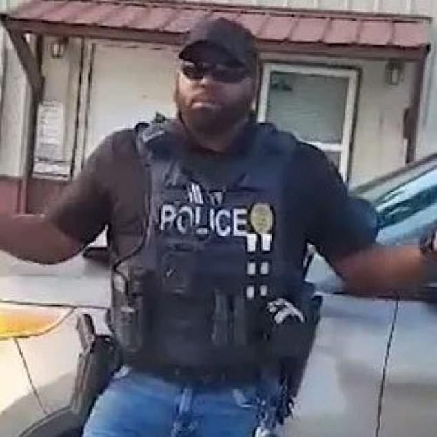 Officer Woodson (pictured) has since been placed on paid leave amid backlash from small town residents. They push to fire the officer for his actions