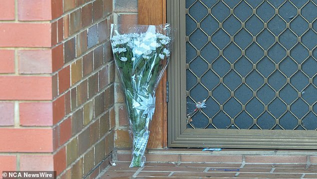 Flowers left at the scene where a five-year-old girl died in Adelaide on Wednesday