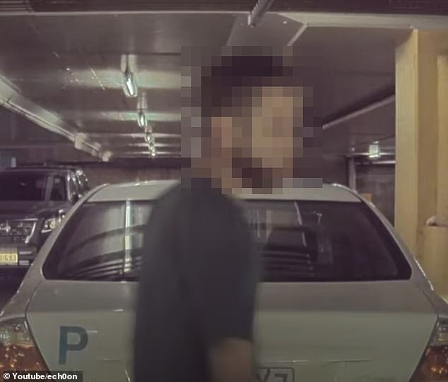 The man put the key in the car after the Tesla double-parked in a busy car park in Queensland.