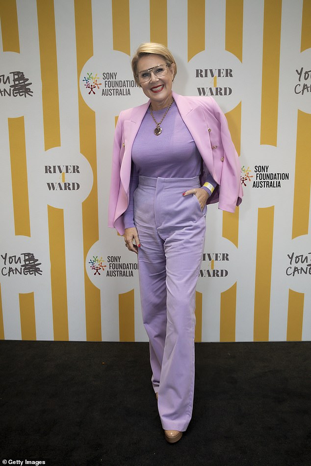 Julia Morris dressed to impress in purple pants, matching shirt and pink blazer