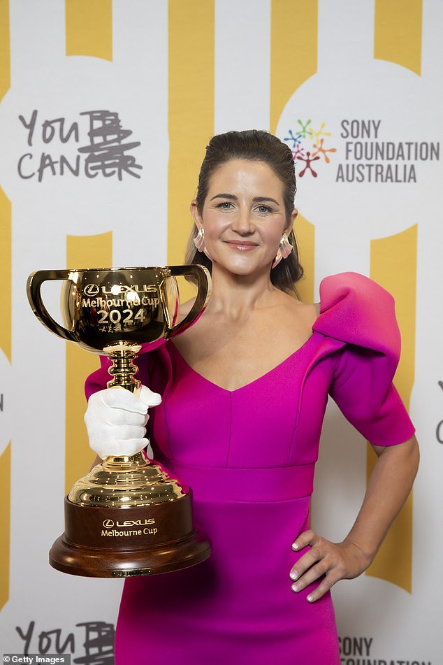 Melbourne Cup winning jockey Michelle Payne made sure all eyes were on her as she arrived in a bright pink dress with puffed sleeves.