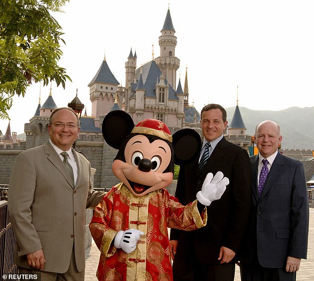 Jay Rasulo (left) with Mickey Mouse and Bob Iger (center right) in 2005. The former CFO worked at the company for 30 years. Iger recently revealed that the company 