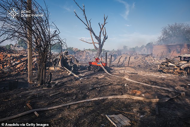 Ukrainian firefighters with the Magirus Wolf C1 tactical robot carry out extinguishing tasks at the site of the Russian air strike in the private residential area of ​​the city of Oleksievo-Druzhkivka