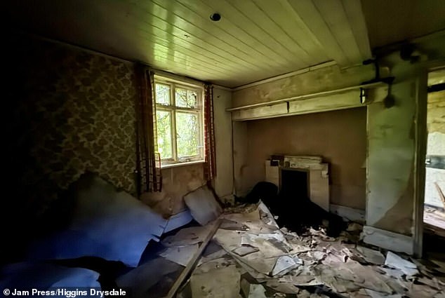 One of the ground floor reception rooms which has a wooden ceiling and is in good condition (pictured)