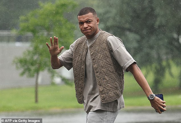 France captain Kylian Mbappé cut a more professional figure in his neutral-toned ensemble.