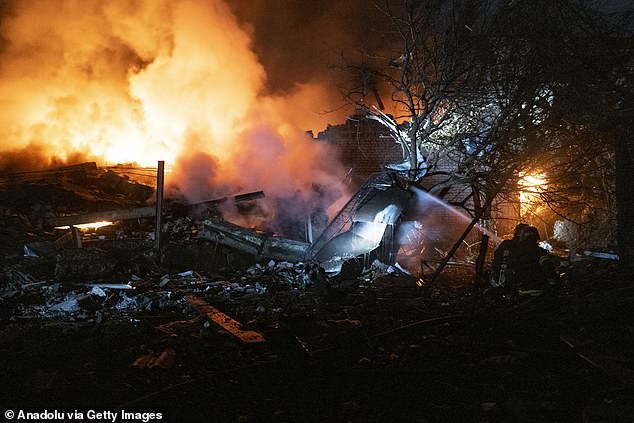 Firefighters try to extinguish a fire that broke out in a building destroyed after a Russian bombing overnight, in the center of Pokrovsk, Ukraine, Nov. 30, 2023.