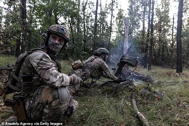 Ukrainian soldiers fire a grenade launcher as the war between Russia and Ukraine continues in the direction of Avdivka.