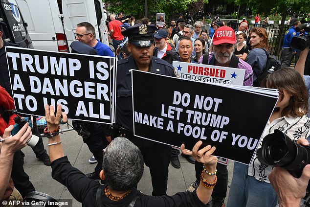 Police arrested a woman after she waved signs saying 