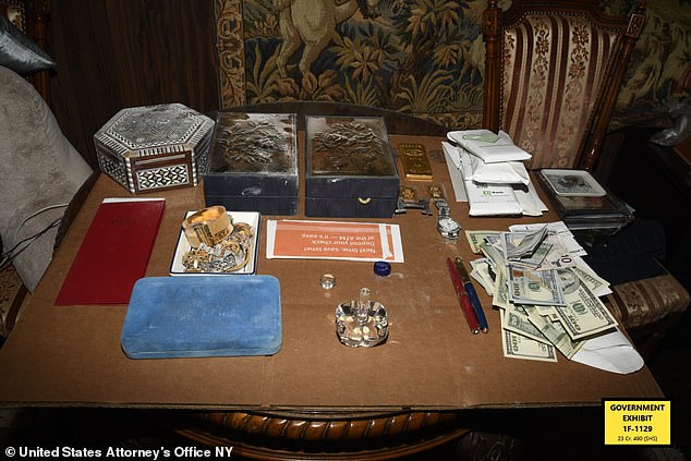 During the raid, authorities found $480,000 in cash scattered around the home.