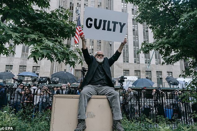 An anti-Trump protester reacts outside the courthouse after former US President Donald Trump was found guilty during his criminal trial.