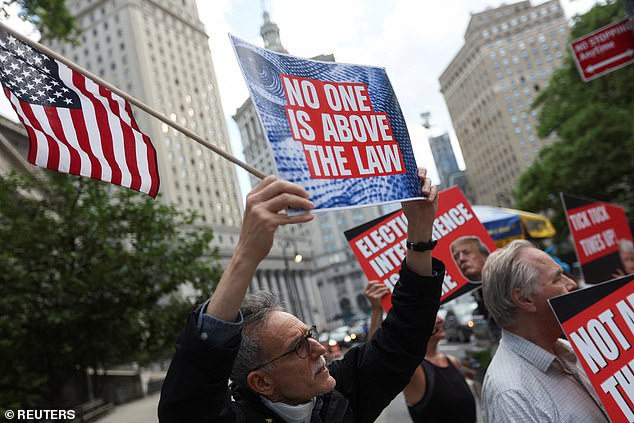 People celebrate outside Manhattan Criminal Court after the verdict.