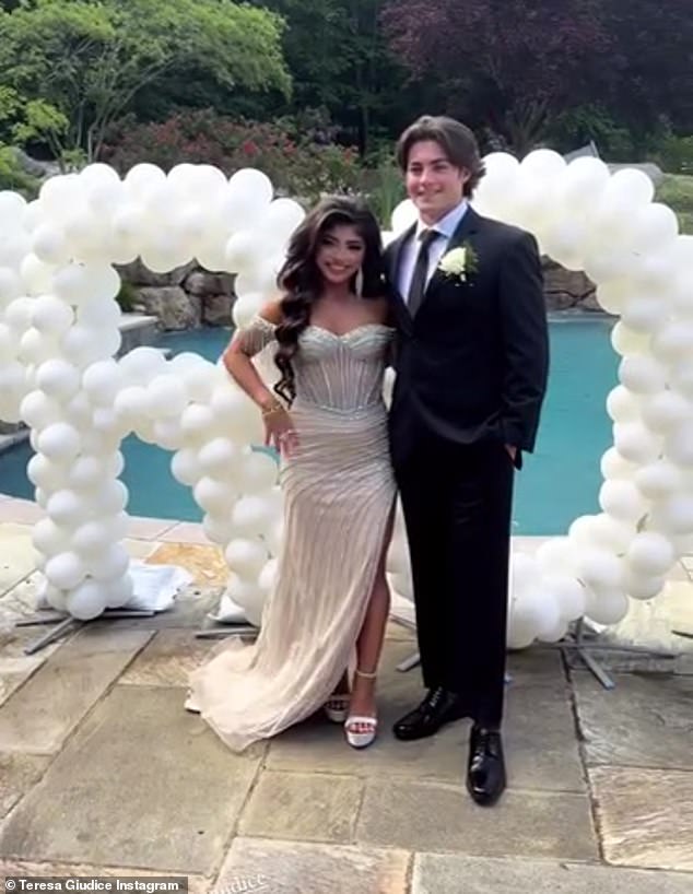 The couple took photos in front of a huge collection of balloons that read 'Prom.'