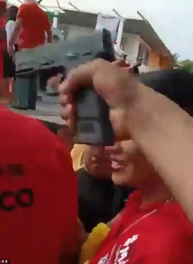 The gunman's gun appeared on video as mayoral candidate Jose Cabrera greeted supporters before pulling the triggers and firing two shots. The suspect, whose name has not been released by authorities, was shot and killed.