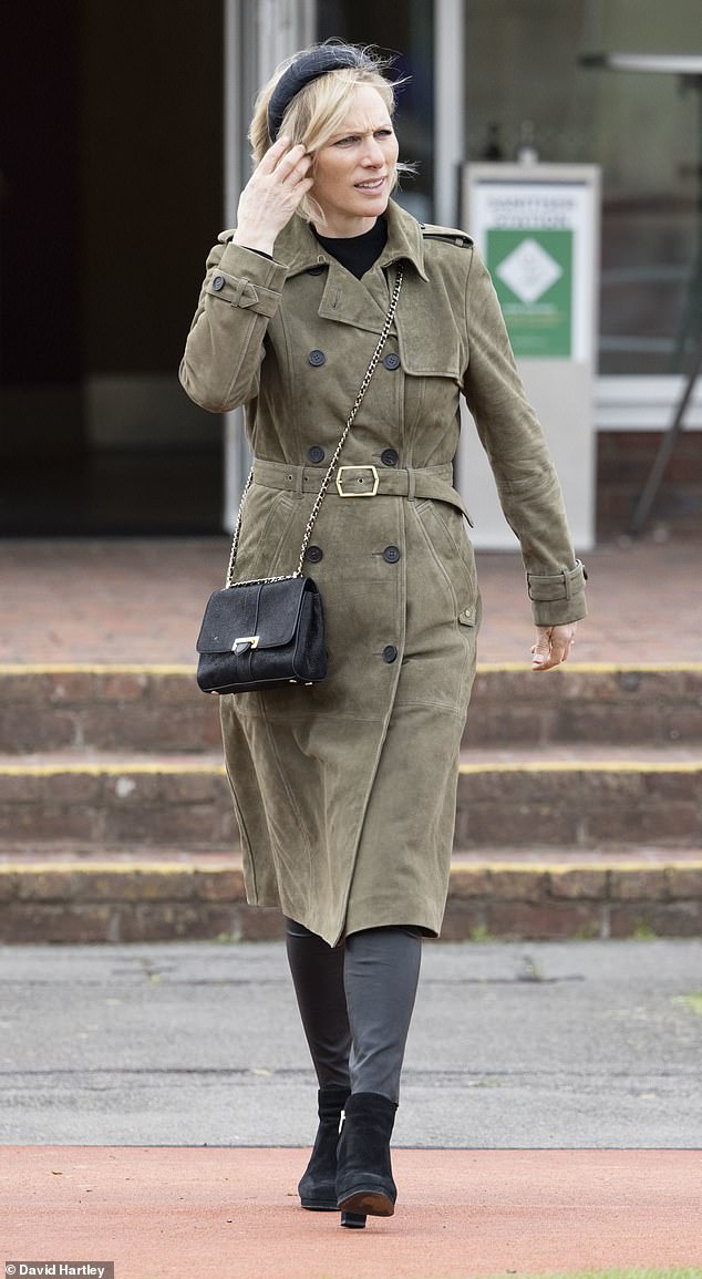 Zara Tindall paired chic leather trousers with a suede trench coat for a visit to the races in April.