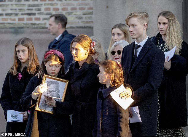 Ari Behn's three daughters, pictured, mourning the death of their father while their mother holds two of her children under her arm.