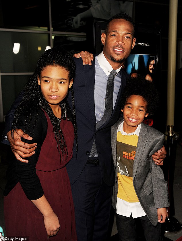 Kai, Marlon and Shawn pose at the premiere of A Haunted House at the Arclight Theater on January 3, 2013.