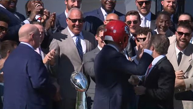 Butker could even be seen smiling after the president put on a Chiefs helmet on Friday.