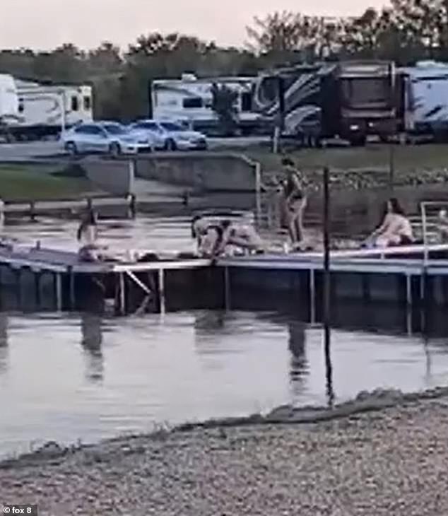 Video of the incident shows Gilbert's friends casually looking at the water as he struggled for up to 20 minutes to save himself in the lake in Farmerville, Louisiana.