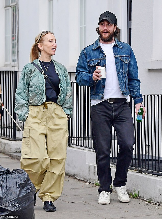 Aaron Taylor-Johnson, 33, dressed in denim, enjoyed a cup of coffee as he joined his wife Sam, 57, for a sunny stroll through London on Thursday.