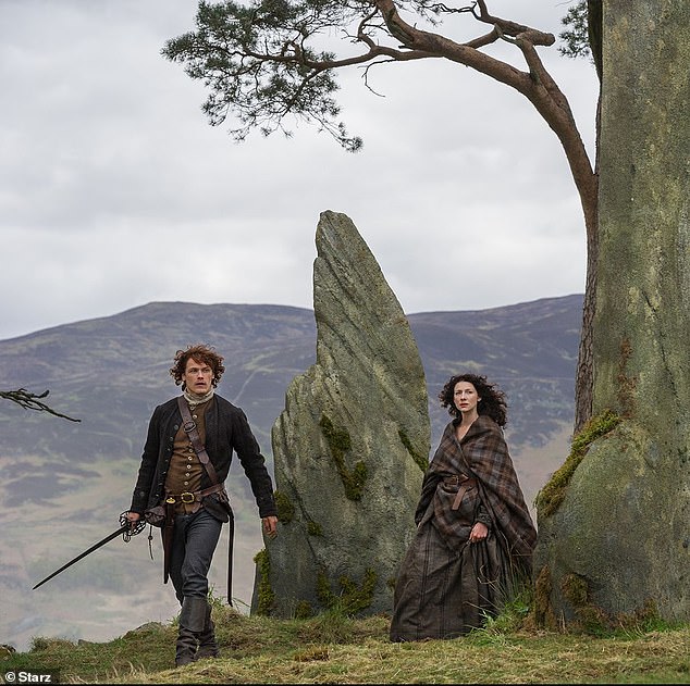 Sam Heughan, who plays Jamie Fraser, and Caitriona Balfe, who plays Claire Randall-Fraser, in the fictional Craigh na Dun.