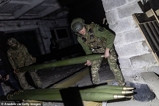 Ukrainian soldiers unload grade shells in a garage in the direction of Marinka, as the war between Russia and Ukraine continues in Donetsk Oblast, Ukraine, last week.