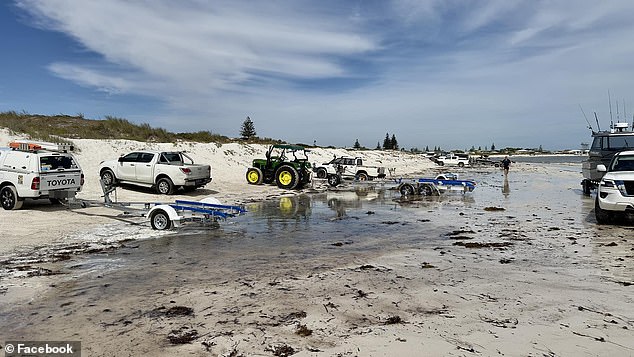 Vehicles launch boats from Lancelin Beach in Western Australia