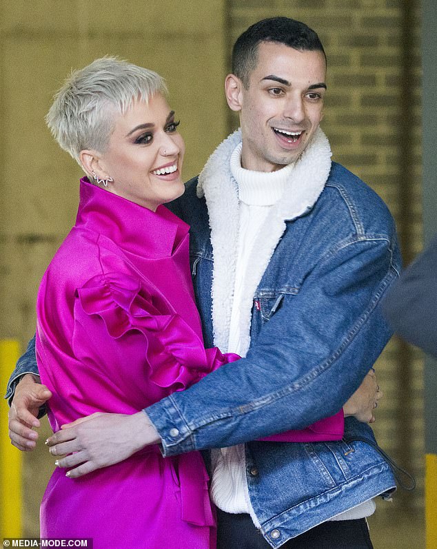 More photos have emerged of accused cop killer Beau Lamarre-Condon during his time as a celebrity-chasing paparazzo.  He is pictured with pop star Katy Perry in Sydney in 2017.