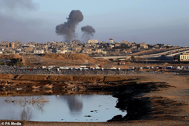 Smoke rises after Israeli airstrike near the separation wall between Egypt and Rafah