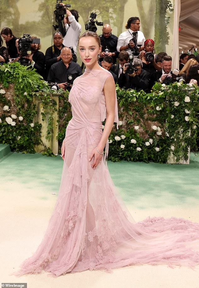 Phoebe Dynevor gave Victoria Beckham her Met Gala debut as she channeled a classic English rose in a sheer pink dress from the designer.