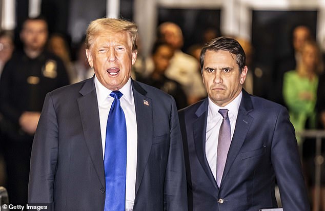 Former President Donald Trump and his lawyer Todd Blanche (right) leave the courthouse