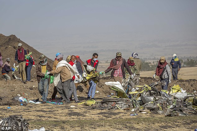 Rescuers work at the scene of the crash of an Ethiopian Airlines Boeing 737 Max 8 flight near Bishoftu, or Debre Zeit, south of Addis Ababa, Ethiopia, on March 11, 2019.