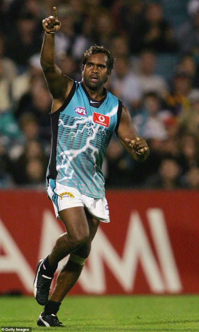 The football great (pictured playing for Port Adelaide in 2005) was known for his tough play and has been recognized as one of the greatest Indigenous stars in AFL history.