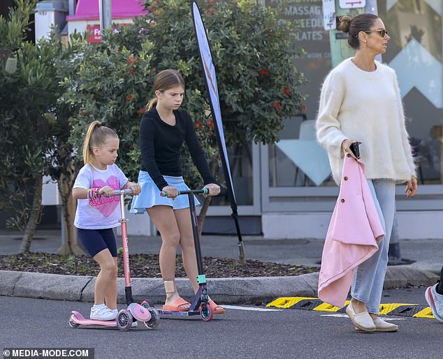 On Sunday, David and his wife Candice took a stroll through the Sydney suburb of Maroubra with their three daughters.