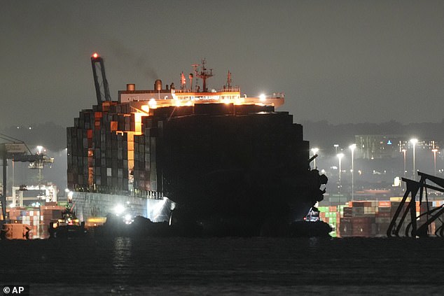 Crews work to refloat the Dali in preparation to move the cargo ship during high tide in Baltimore, Monday, May 20, 2024.