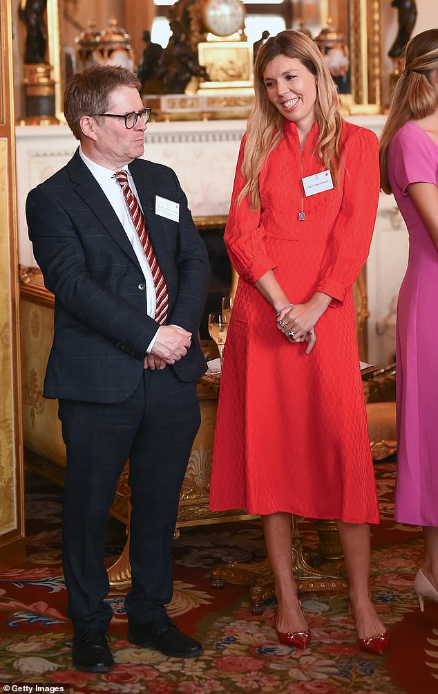 Shadow Minister for Victims and Sentencing Kevin Brennan speaks to Carrie Johnson as they attend a reception hosted by Queen Camilla in recognition of those who support survivors of sexual assault.