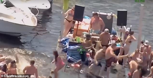 The 2022 fight (pictured), which was caught on video, took place in and around a terrace where a DJ had set up to play records in the water.