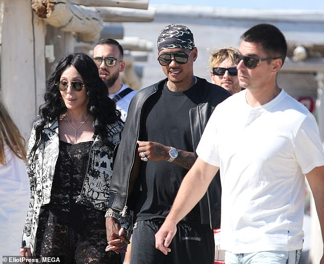 The couple were seen walking hand in hand moments after landing at the internationally famous seaside resort following a 50-mile helicopter ride.