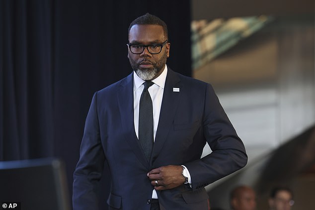 Mayor Brandon Johnson (pictured) attempted to force his way into the funeral of slain Chicago police officer Luis Huesca, despite family telling him to stay away, according to reports.