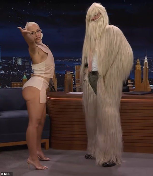 Doja Cat showed off her butt while appearing on Wednesday's episode of The Tonight Show Starring Jimmy Fallon on NBC.