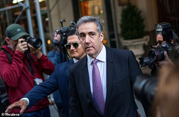 Michael Cohen, former lawyer for Republican presidential candidate and former US President Donald Trump, leaves his Manhattan home to testify in Trump's criminal trial on charges of falsifying business records to hide money paid to hush porn star Stormy Daniels in 2016, In New York. City, United States, May 20, 2024. REUTERS/Eduardo Muñoz