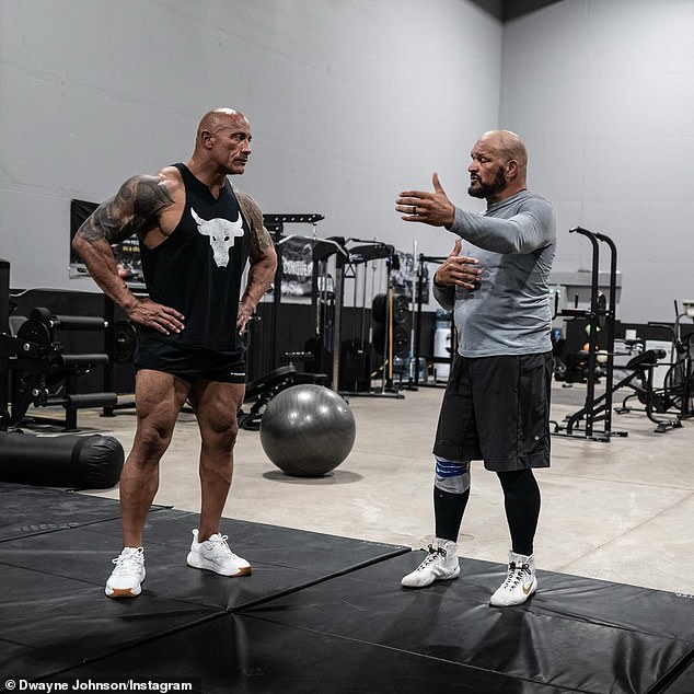 Mark (R), now 55, has been helping Johnson, a third-generation WWE wrestler, prepare to portray him more authentically by accompanying him at his MMA training camp, where he has been 