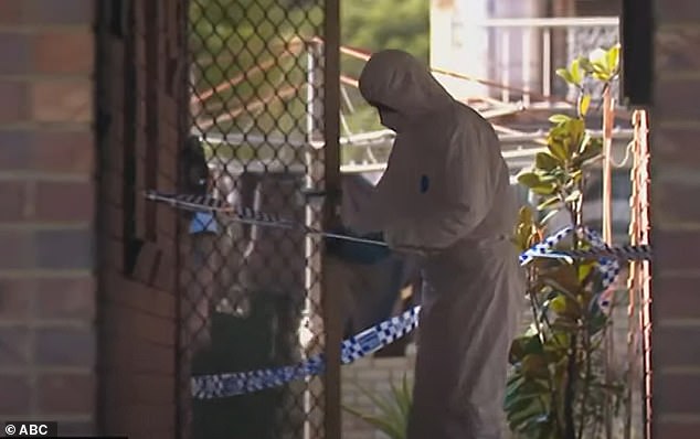 Forensic teams appear at the unit on College Street in East Lismore, on the New South Wales north coast, on Monday.