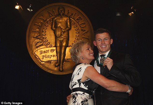 Carney receives a hug from his mother Leanne after returning from being released by the NRL to win the Dally M Medal playing for the Sydney Roosters.