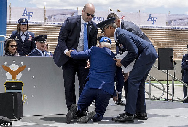 President Joe Biden falls to the stage during the 2023 United States Air Force Academy graduation ceremony