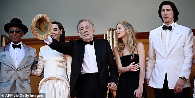 Megalopolis, which premiered last night at the Cannes Film Festival, centers on a super-powered architect who attempts to rebuild New York City into a modernist utopia.  In the photo, from left to right: Giancarlo Esposito, Aubrey Plaza, Francis Ford Coppola, his granddaughter Romy Coppola and Adam Driver.