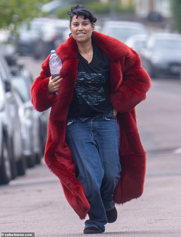 Giggling Raye suffered a wardrobe malfunction as she struggled to hold on to her unbuttoned jeans as she rushed to film a new music video in Shepherd's Bush on Thursday.
