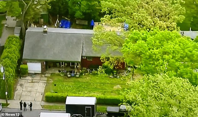 An aerial view of police at the Massapequa Park home of suspected serial killer Rex Heuermann.